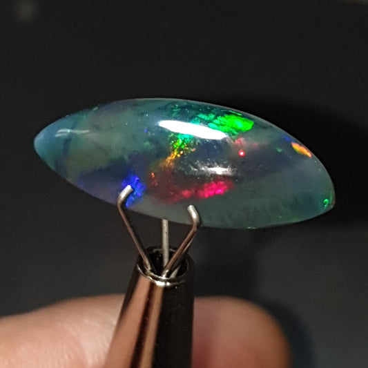 5.45 carat black smoked rainbow welo opal